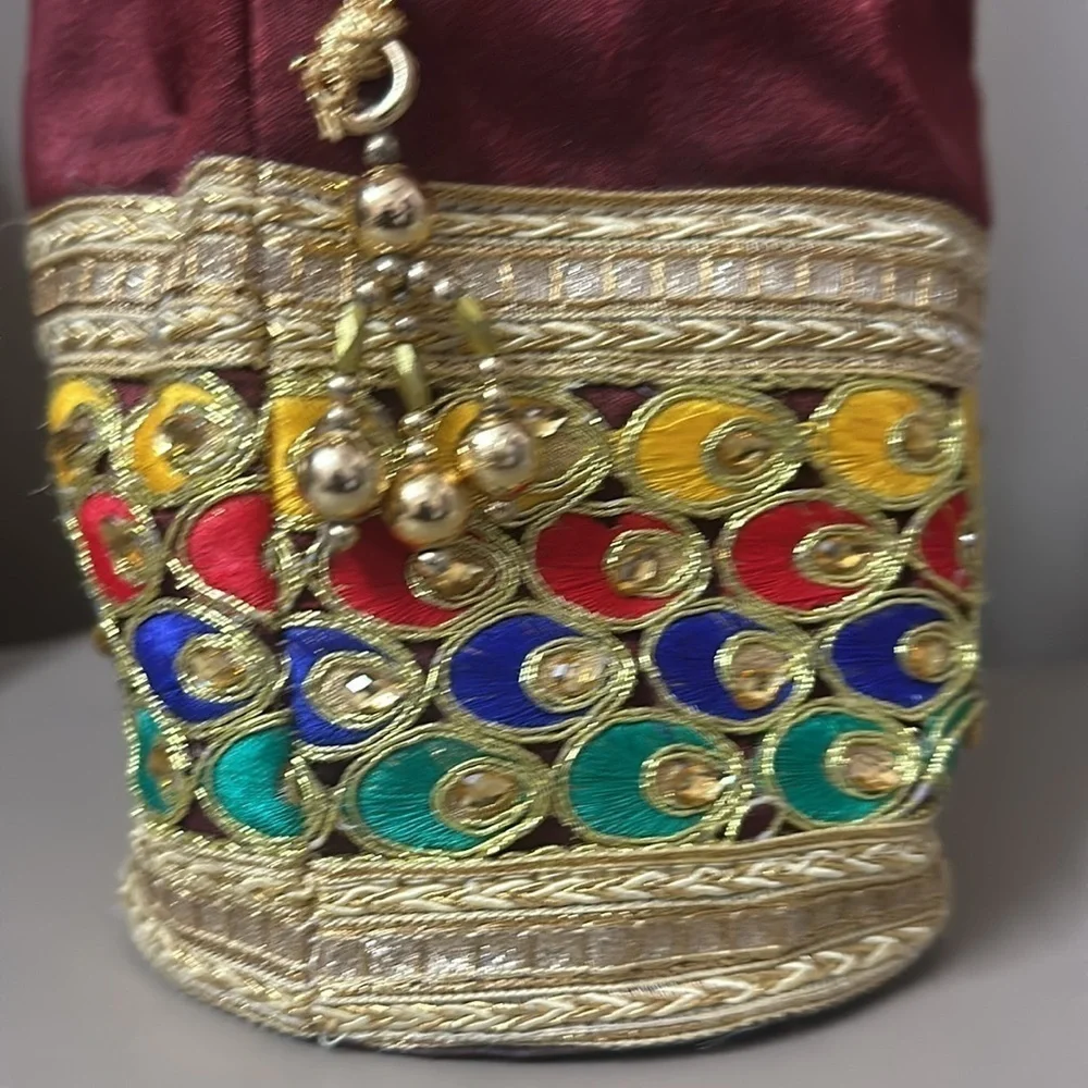 Beaded peacock colored jewelry bag